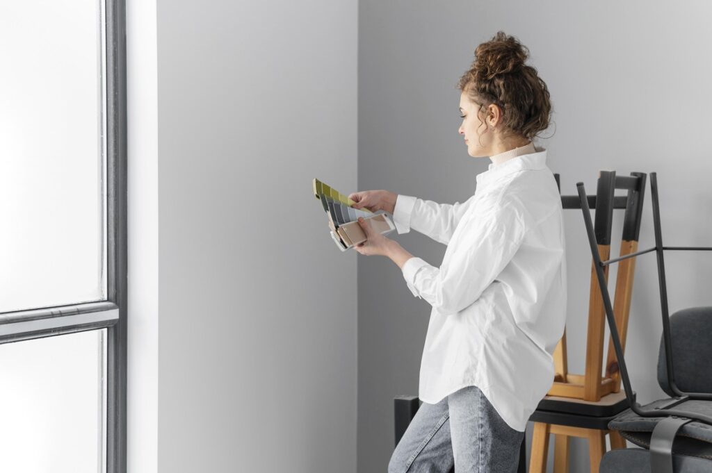 Woman seeing what color matches with Morning Fog Sherwin Williams